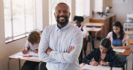 Welcome to our world of learning. Portrait of mature man teaching a class of teenage students. - Powered by Adobe