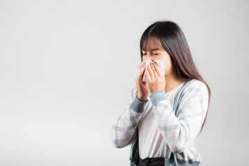 Unhappy woman bad mood her cry wipe mucus with tissue, beautiful young female stress feel sneezing sinus use towel to wipe snot from nose, studio shot isolated on white background with copy space