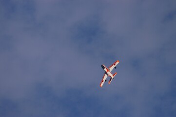 Japanese trainer aircraft T-1 flying against the background of autumn blue sky
