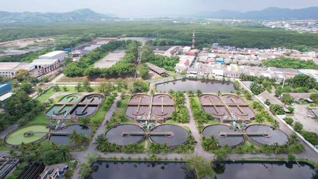 Aerial view High angle view Top down drone shot of the sewage treatment plant.The Solid contact clarifier tank type sludge recirculation in water treatment plant. Industrial wastewater treatment plant
