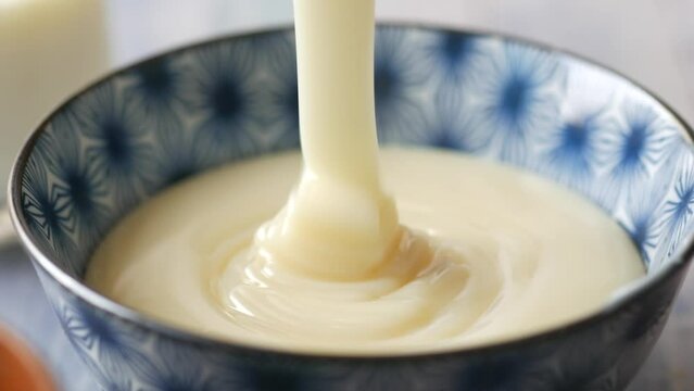 condensed milk in a bowl close up,