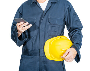 Worker standing in blue coverall holding hardhat and use smartphone