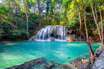 Fototapeta na wymiar Erawan waterfall in Thailand. Beautiful waterfall with emerald pool in nature.