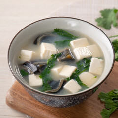 Delicious tofu and century egg soup with coriander.
