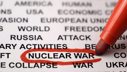 Putin threatening with nuclear war concept. Black text on white paper. Red circle. Russian invasion...