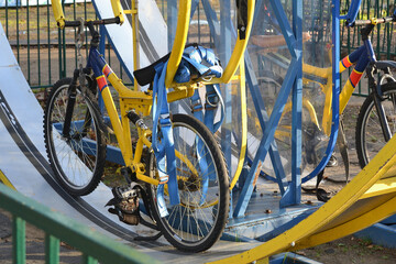Extreme attraction with bicycles in the city amusement park, details.