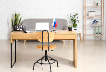 Interior of modern office with Russian flag