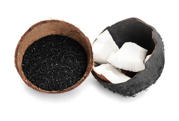 Coconut shells with activated carbon on white background