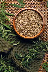 Bowl with hemp seeds on table