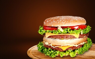 Burger with salad, cheese and bacon.