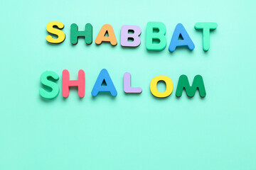 Text SHABBAT SHALOM on color background - obrazy, fototapety, plakaty