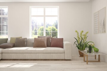 Fototapeta premium White living room with sofa and summer landscape in window. Scandinavian interior design. 3D illustration