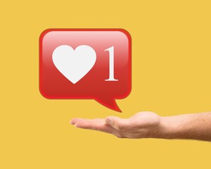 Man hand holding social media like icon with sign to follow subscribe