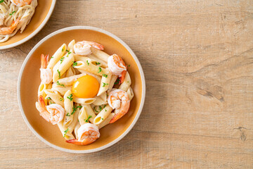 penne pasta white cream sauce with shrimps and egg