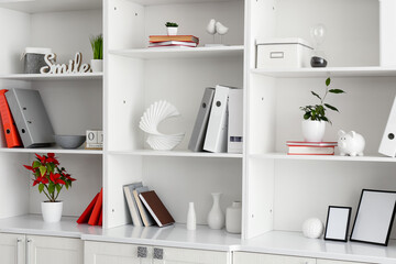 Shelf unit with beautiful decor in room