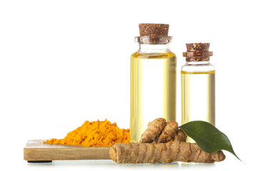 Bottles of oil, turmeric root and powder on white background