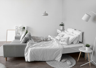 Fototapeta na wymiar Interior of modern bedroom in white colors