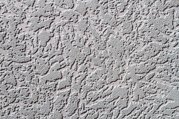 Abstract background texture of the wall with a relief coating.