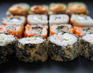 Japanese sushi food. Maki ands rolls with tuna, salmon, shrimp, crab and avocado.