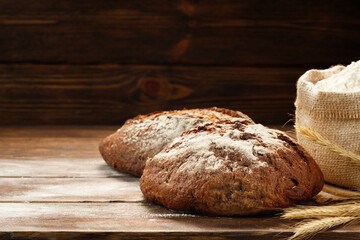 Freshly baked traditional bread on a wooden table.