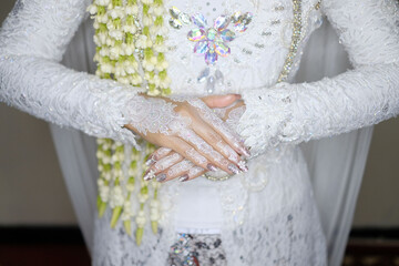 traditional wedding, bridal showing henna design and hand jewellery