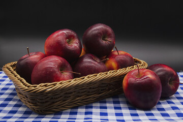 Fototapeta na wymiar Several red apples are placed in a wicker basket.Include Clipping Path.