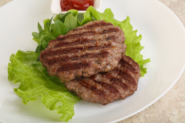 Grilled beef burger cutlet with sauce