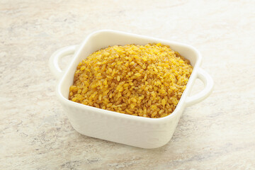 Raw bulgur in the bowl