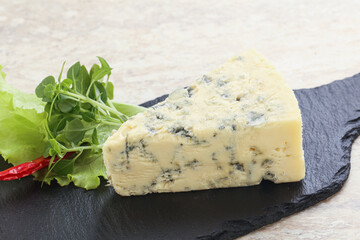 Blue cheese piece over board