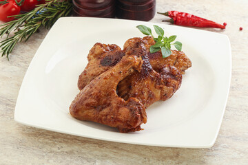 Roasted chicken wings with spicy sauce