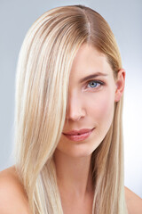 Naklejka premium Blonde and beautiful. Studio portrait of a young woman with long blonde hair.