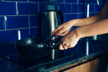 Closeup Young man cooking fresh food at home.