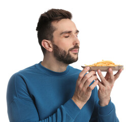 Man with French fries on white background