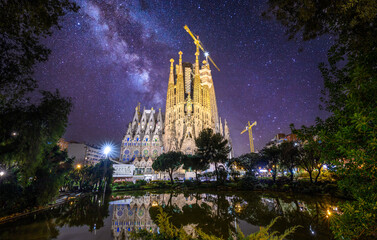 Sagrada Familia at night, a large Roman Catholic church in Barcelona, Spain, designed by Catalan...