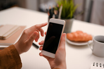 Close-up, Female finger typing on smartphone screen