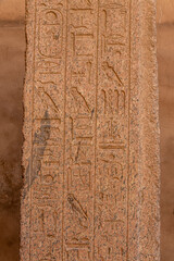 Ancient Egyptian murals and writings on the stone walls of the Karnak Temple in Luxor