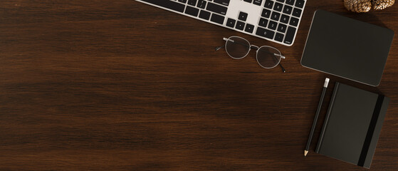 Overhead shot, Dark wooden office table background with copy space