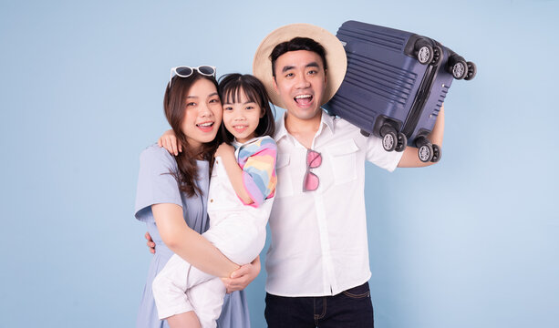 Image Of Young Asian Family Travel Concept Background