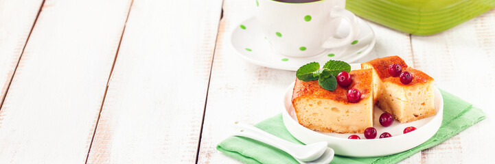 Cottage cheese casserole on a light background. Selective focus. Copy space