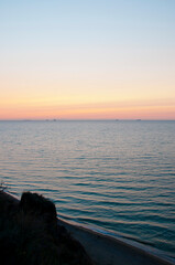 sunrise morning sky and sea with ship on horizon, summer