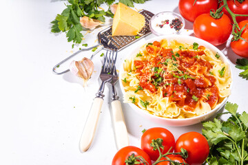 Mediterranean Italian pasta lunch. Classic pasta with marinara sauce, farfalle pasta with tomato sauce, cheese, fresh herbs 