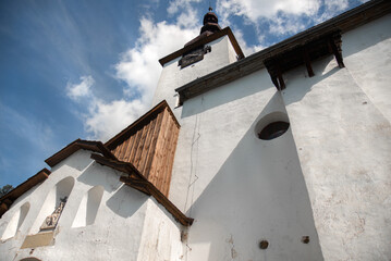 Beautiful historic church in the Spania Dolina village.  Slovakia, Europe.  - obrazy, fototapety, plakaty
