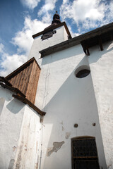 Beautiful historic church in the Spania Dolina village.  Slovakia, Europe.  - obrazy, fototapety, plakaty