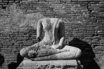 Broken ancient Buddha statue.