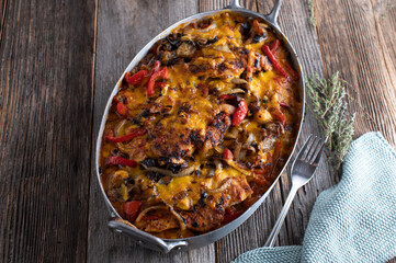 Oven baked chicken casserole with vegetables and cheese crust
