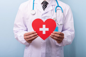 Doctor hands holding red heart, health care, hope, life insurance concept, world heart day, world health day, organ donor day.