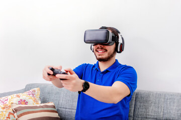 Bearded man using the virtual reality headset and controller.