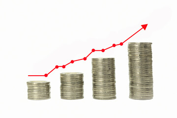 Coins stacked in piles and financial chart