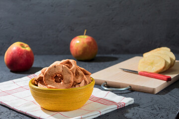 Fresh apples and dried apples on the table
