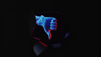 Lab test failure. Unsuccessful clinical trial. Doctor hand in glove showing thumb down gesture in black breakthrough paper hole with neon color light isolated on dark empty space. - Powered by Adobe